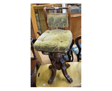 A late Victorian walnut adjustable piano stool, and an Ercol two tier table (2)