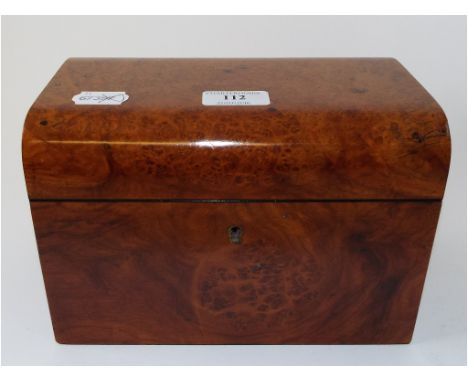 An amboyna tea caddy, fitted two canisters, 22.5 cm wide