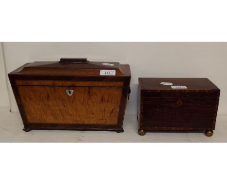 A satinwood and mahogany box, of sarcophagus form, 30 cm wide, and an inlaid mahogany tea caddy (2)