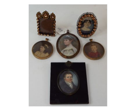 An oval bust portrait miniature, of a gentleman, watercolour, 6.5 x 4.8 cm, four others, and a miniature frame (6)