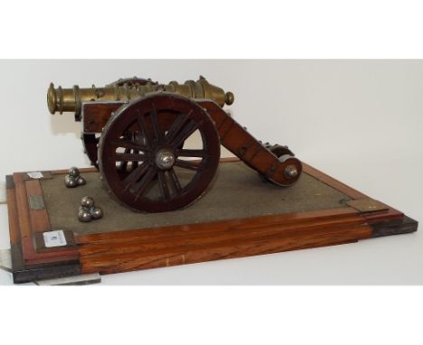 A scale model of a Zamzamah gun, also known as Kim's Gun, scale 1 inch:1.25 ft, mounted on a wooden plinth, 32 cm wide