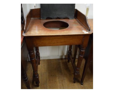 A Victorian mahogany washstand, 61 cm wide, another similar, a mahogany kneehole table, a dropleaf table, a papier mâché fire