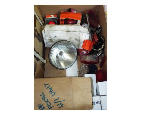 Assorted motoring spares, including a pair of Lucas rear light lenses, No 574635, a pair of Lucas pre focal head light units,
