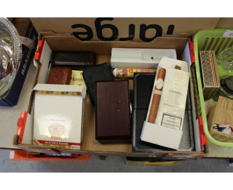 Box of cigar cutters, lighter, cases, leather holders