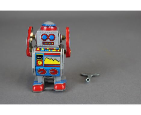 Clockwork tin robot toy