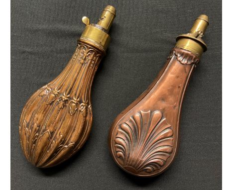 A Brass and Copper Powder Flask embossed with a design of a Clam Shell. Four adjustable measures of black powder can be dispe