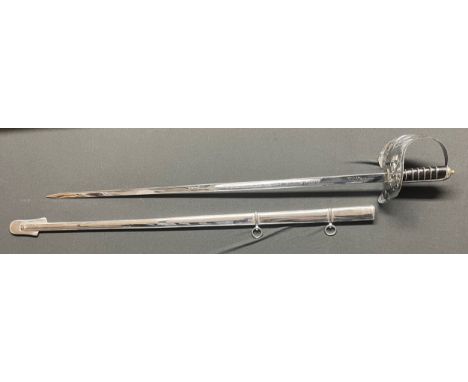 Reproduction British ERII Pattern Officers Dress Sword with heavy plated fullered etched blade 850mm in length. No edge to bl