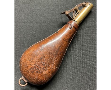 A 19th Century Brass and Leather Shot Flask. Adjustable to enable two different measures of shot to be dispensed. D ring susp