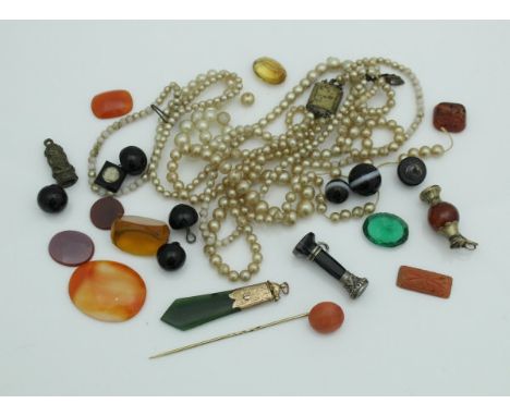 A collection of assorted hardstone cut cameos, a jade set gold monted pendant and various buttons