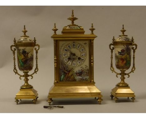 A late 19th Century French lacquered brass cased clock garniture the eight day movement by Japy Freres of Paris the painted p