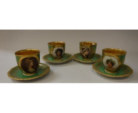 A set of four Vienna porcelain cabinet cups (36454) each decorated with a hand painted portrait of young woman within a gilt 