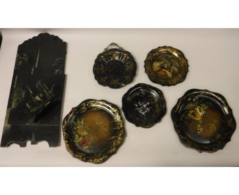 A Victorian black lacquered and mother of pearl inlaid papier-mache three fold fire screen, decorated with a church at night 