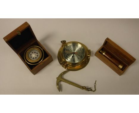 A collection of "Nautical" items including a ship's clock "Ship's time quartz", a reproduction brass cased ship's compass, br