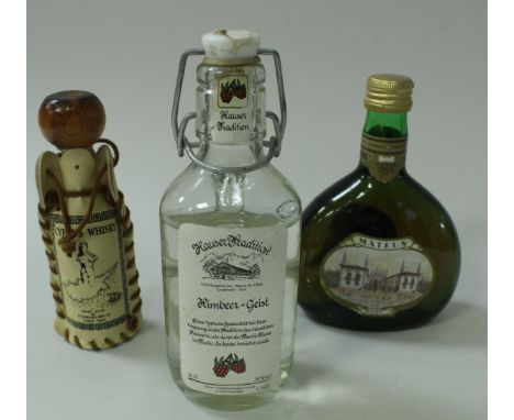 A box of various miniatures to include Highland Malt Scotch Whisky in a Loch Ness Monster bottle, Black Mountain liqueur, Kim