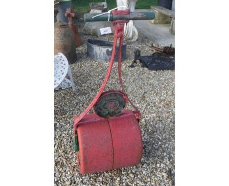 A painted Victorian cast metal lawn roller inscribed "T. Green &amp; Son Limited Griffin Leeds and London"