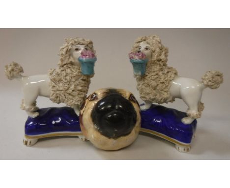 A pair of circa 1900 Sampson of Paris poodle figurines with gold anchor mark to base together with a polychrome enamel pug he