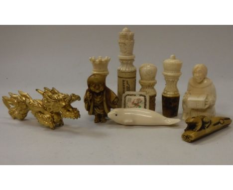 A collection of various carved bone and other bottle stoppers, carved gilt Chinese dragon ornament, various Inuit carved item