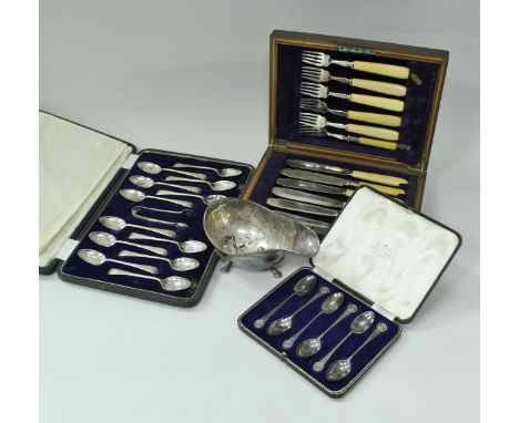 A cased set of twelve George V silver teaspoons with matching sugar tongs (by Duncan &amp; Scobbie, Sheffield 1918), together