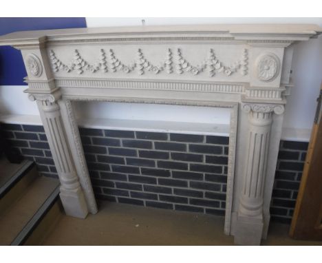 A modern painted oak fire surround in the 19th Century style