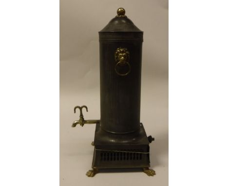 A late 18th Century Dutch tin and brass mounted tea urn of cylindrical form, with lion mask ring handles, brass tap over a bu