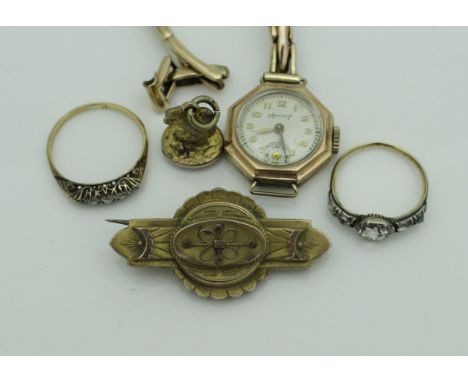 A ladies 9 carat gold cased Accurist wristwatch No'd. "1278" to back, a Victorian 9 carat gold bar brooch, an 18 carat gold a