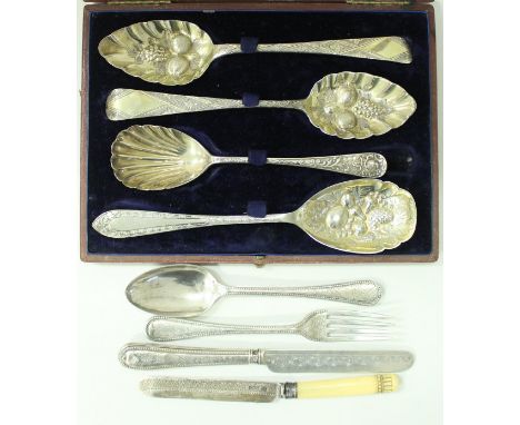 Two Georgian table spoons with later embossed berry decoration, a Victorian silver spoon with scalloped bowl, a similar plate