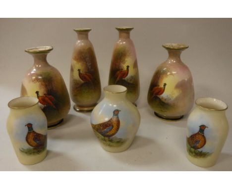 A pair of Samuel Fielding &amp; Co Crown Devon vases decorated with cock and hen pheasant by J Coleman, another pair similar 