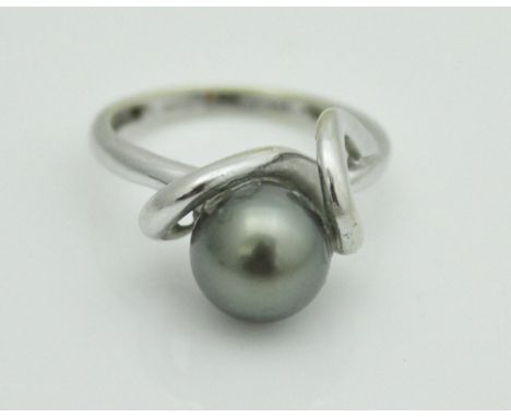 An 18 carat white gold ring with Tahitian grey pearl, ring size P, 5.4 g total