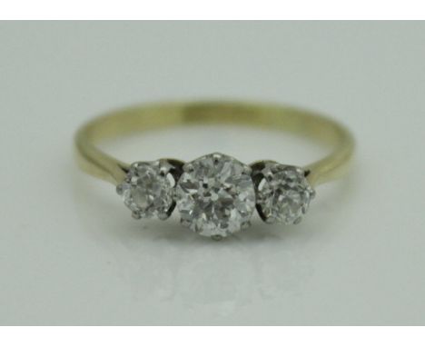 A 9 carat gold three stone diamond set ring, approx 1 carat total, size S