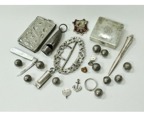 A collection of silver and plated wares to include two whistles, one of curved tapering form, a silver paperknife, a silver b