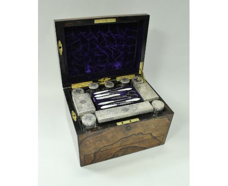 A Victorian coromandel and ebonised vanity case containing various cut glass dressing table bottles with silver plated mounts