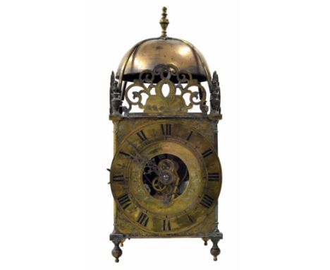 Cromwellian Eureka brass electric lantern clock, the 7" brass chapter ring enclosing a foliate engraved plate inscribed Eurek