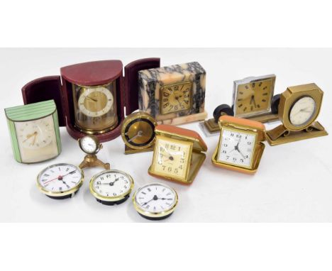 Small Junghans travelling mantel clock within a demi lune folding Morocco case; also six other various small mantel timepiece
