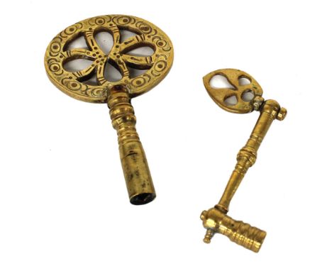 Two interesting early brass clock keys, one for a bracket and one for a table clock (2) 