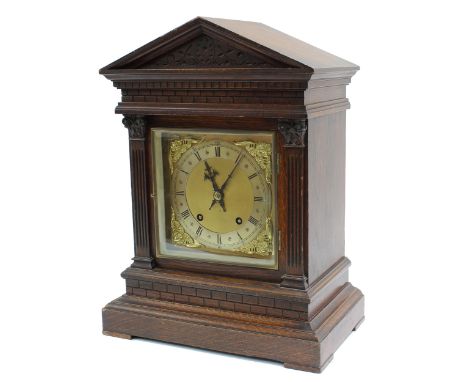 German&nbsp;oak ting-tang mantel clock, the W &amp; H movement playing on two gongs, the 6.5" square brass dial with silvered