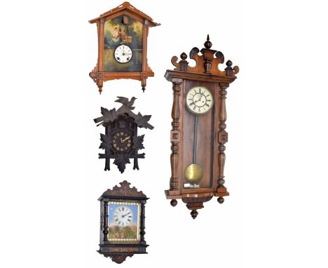 Black Forest two train cuckoo clock, the 4.5" chapter ring within a chalet case carved with vine leaves and surmounted by a b