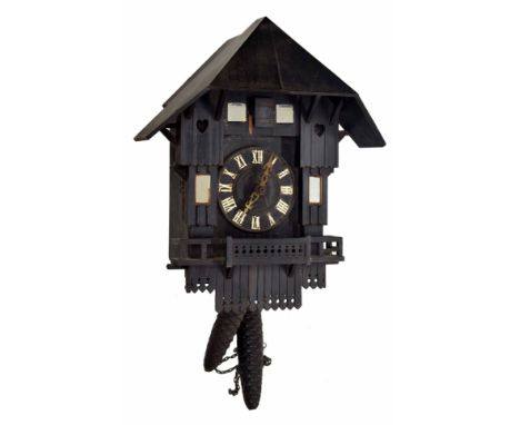 Black Forest two train cuckoo clock, the 4.75" dial recessed into a mirrored ebonised chalet case, 17" high (pendulum and two