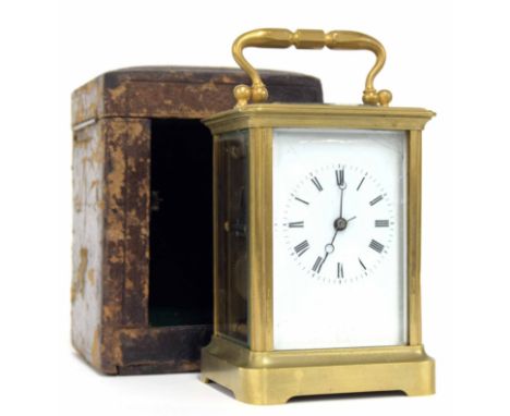 Carriage clock striking on a bell, within a corniche brass case, 6.5" high; also with an outer Morocco leather travelling cas