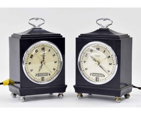 Two Hammond Bichronous electric&nbsp;mantel calendar clocks, within Bakelite cases surmounted by caddy tops and carrying hand