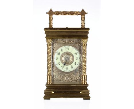 Repeater carriage clock striking on a gong, the 2.25" cream chapter ring enclosing a silvered centre and within a foliate eng
