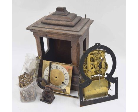 Oak three train musical bracket clock in need of assembly, the 6.5" square brass dial with silvered chapter ring, the movemen