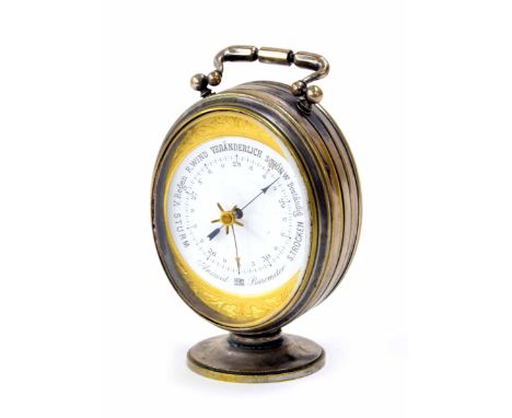 Small attractive double sided desk aneroid barometer and thermometer,&nbsp;within a silvered oval fluted pedestal case with c