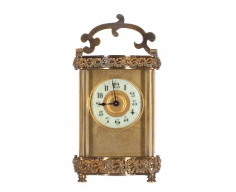 Carriage clock timepiece,&nbsp;the 2" cream chapter ring enclosing a gilt centre and within a plain gilt mask and ornate serp