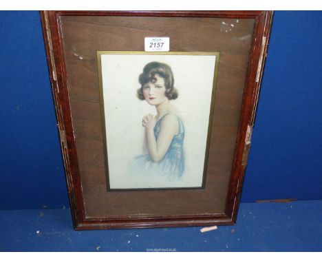 A framed and wooden mounted Print of a three quarter portrait of a Young lady in a blue dress, 13 1/2" x 17 3/4".