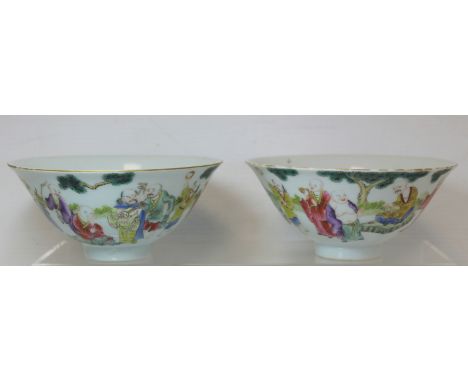 Pair of Chinese porcelain bowls of flared form, the exterior with polychrome enamel continuous band of deities in a garden wi