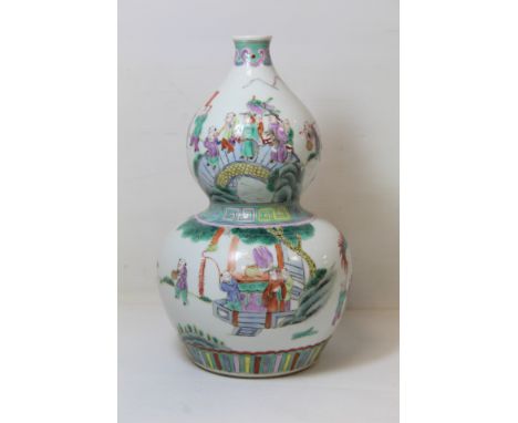 Chinese porcelain vase of double gourd form decorated in polychrome enamels and depicting figures at a procession with dragon