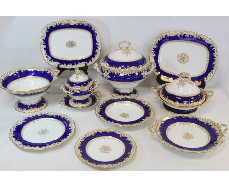 Early 19th century Chamberlain's Worcester part dinner service with blue, white and gilt foliate scroll borders, comprising: 