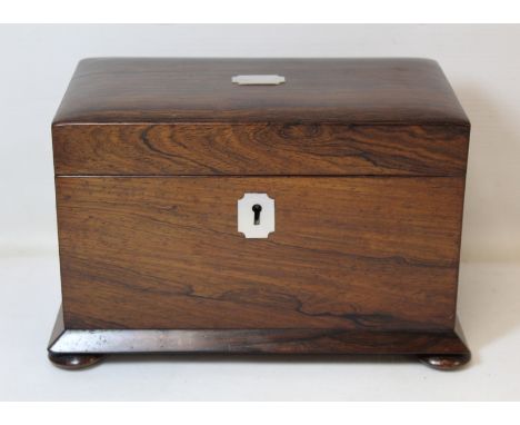 19th century rosewood tea caddy of plain rectangular form with canted base, annular knop feet and inlaid mother of pearl escu