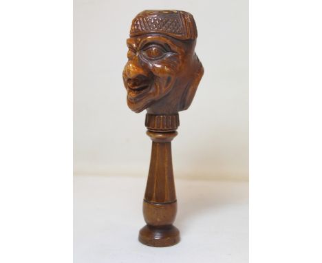19th century antique Continental carved treen nutcracker in the form of a double sided caricature man's head wearing a tassel