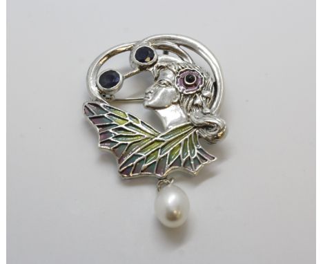 Art Nouveau style silver brooch/pendant depicting a lady set with two sapphires, a ruby, plique-a-jour and a suspended pearl.